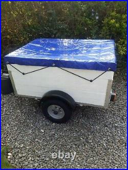 4 x 3 ft box trailer with extended sides and new wheels and waterproof cover
