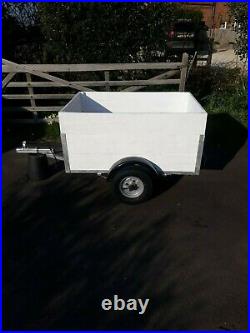 4 x 3 ft box trailer with extended sides and new wheels and waterproof cover