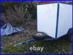 6 ft by 3.5 ft by 4ft 750 Kg covered trailer with rear door good condition
