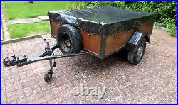Camping trailer with cover
