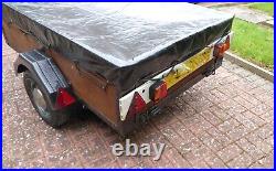 Camping trailer with cover