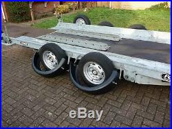 Car transport trailer tilt and ramps fountain trailers
