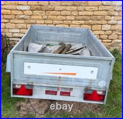 Erde car trailer for camping. Silver. Has a front wheel and a Winterhoff hitch