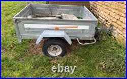 Erde car trailer for camping. Silver. Has a front wheel and a Winterhoff hitch
