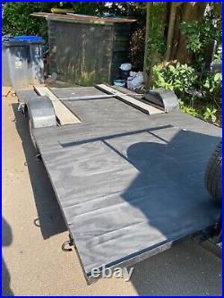 Refurbished Flatbed Trailer with loading ramps and winch. Lots of new parts