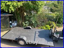 Refurbished Flatbed Trailer with loading ramps and winch. Lots of new parts