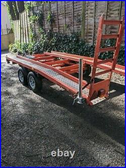 Tilt bed twin axle beavertail car transporter trailer with winch. FITS IN GARAGE