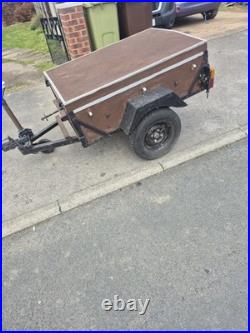 Trailer 123cm Long. 91.5cm Wide. 77cm High. With An Opening Lid On