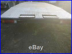 Triple axel, flatbed, beaver tail car transporter trailer